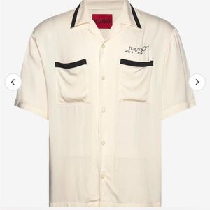 Open white short sleeved Hugo Boss button up shirt.